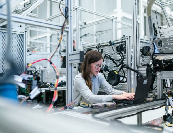 Woman working at desk in aluminium lab